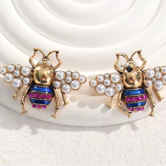 Anthropologie Jewelry - Quenn bee
Gold and Purple Bee Earrings